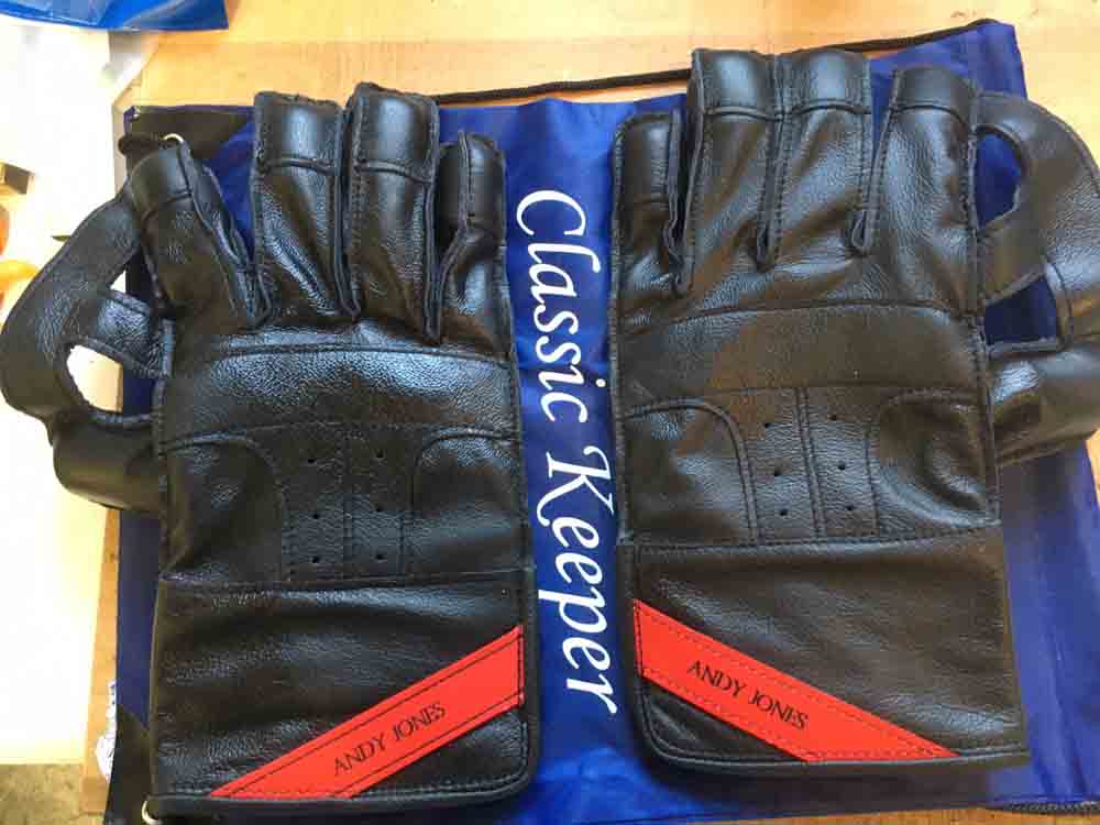 Andy Jones black gloves with red name tag