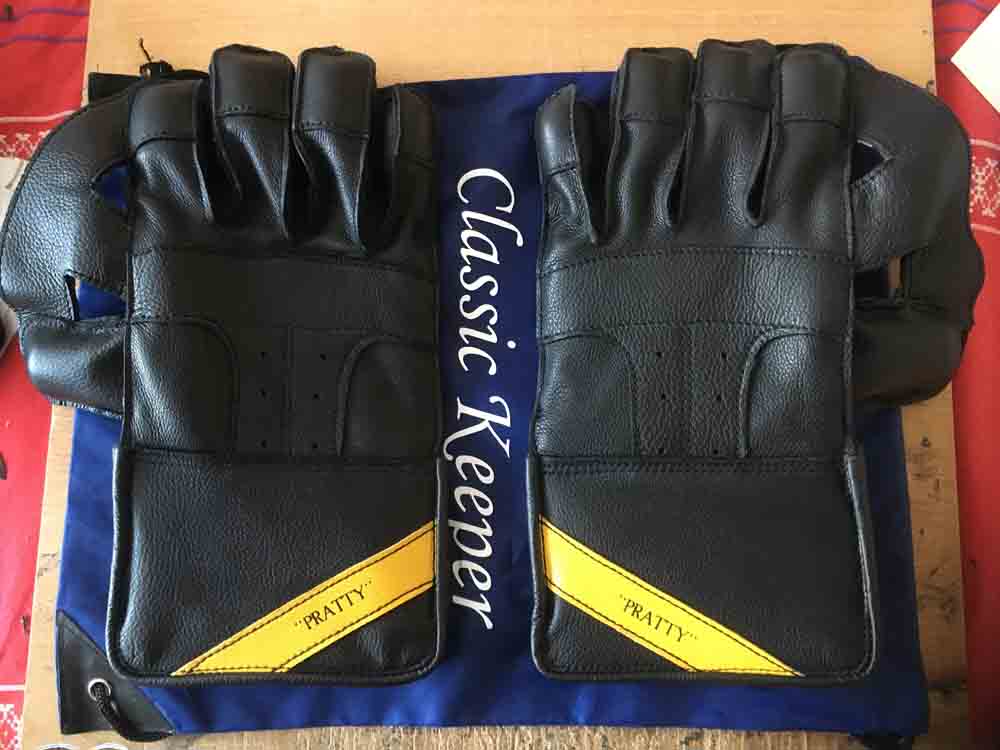 Black gloves with yellow name tag
