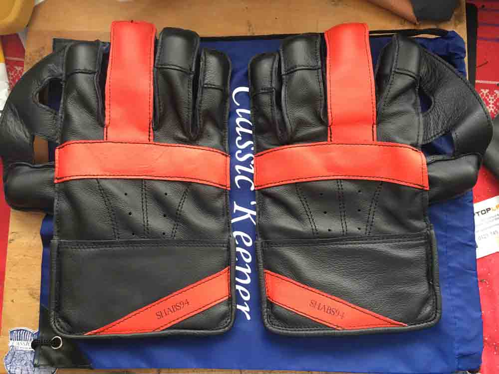 Black gloves with orange feature
