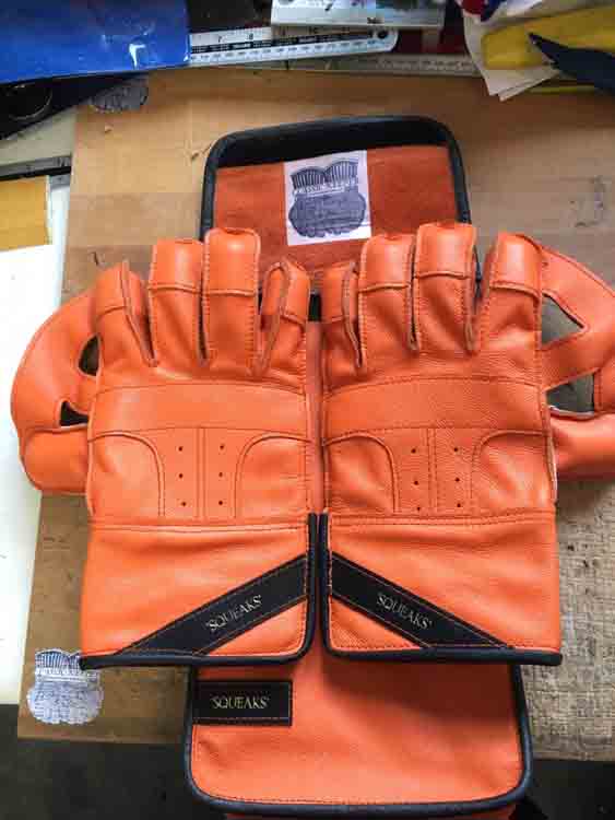 Max Denny Orange wicket keeping gloves with black features